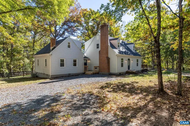 a house with a tree in the background