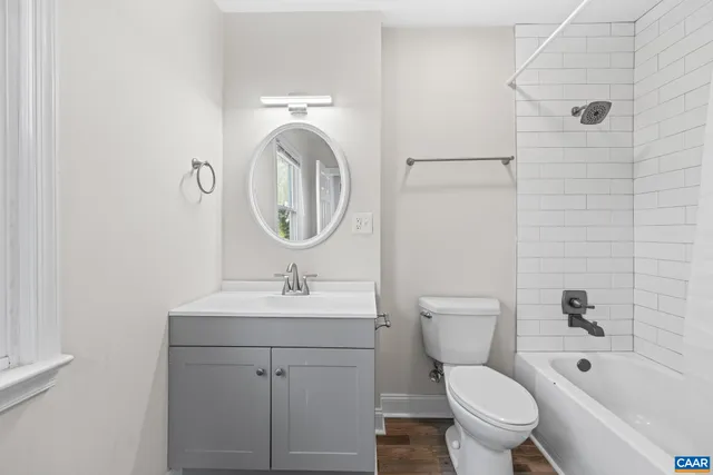 an aerial view of a houses with a yard