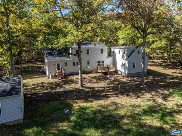 front view of a house with a tree