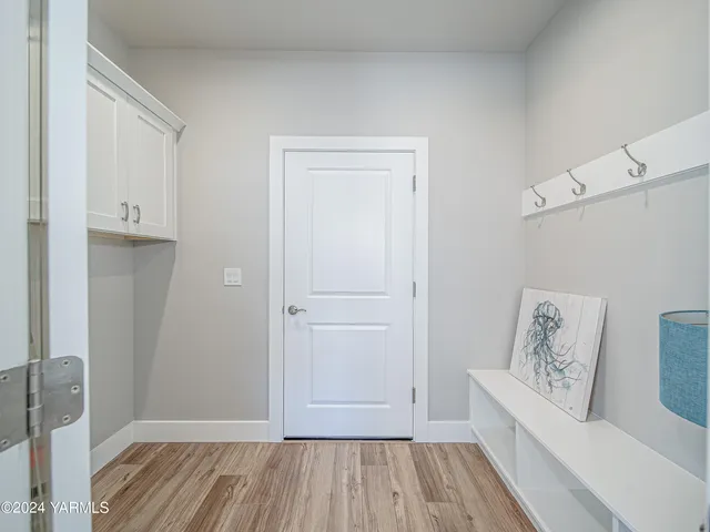 a view of room with window and wooden floor