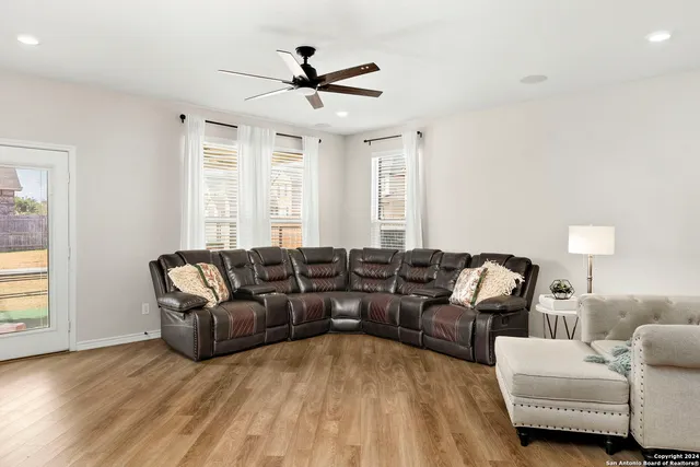 a living room with furniture and a window
