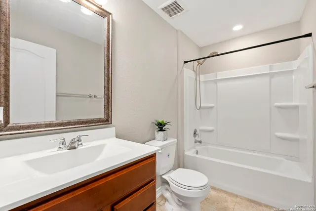 a bathroom with a sink a toilet and a bathtub