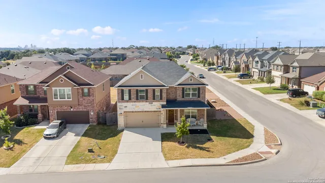 an aerial view of a house with swimming pool