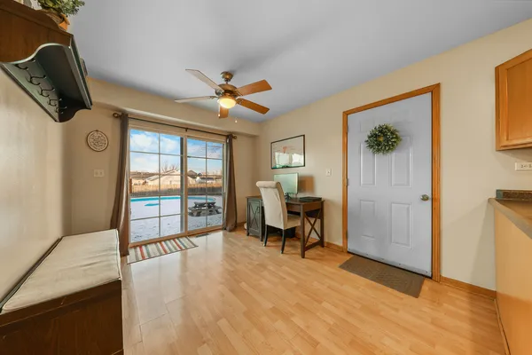 a view of a livingroom with furniture and a window