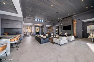 1313 Tortolita Mountain Circle Tucson, AZ 85755 - Photo 12 of 46 a living room with furniture and a flat screen tv