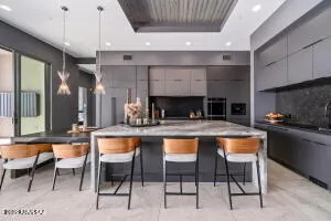 a large kitchen with stainless steel appliances and a counter space