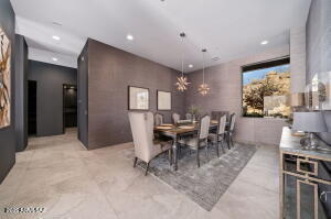 1313 Tortolita Mountain Circle Tucson, AZ 85755 - Photo 20 of 46 a view of a dining room with furniture