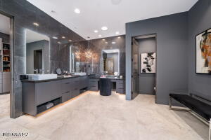 1313 Tortolita Mountain Circle Tucson, AZ 85755 - Photo 29 of 46 a kitchen with stainless steel appliances kitchen island granite countertop a refrigerator and a sink