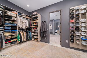1313 Tortolita Mountain Circle Tucson, AZ 85755 - Photo 30 of 46 a view of walk in closet with clothes and shoes