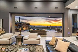 a view of swimming pool with outdoor seating and ocean view