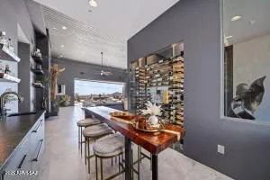 a living room with couch a flat screen tv and a large window