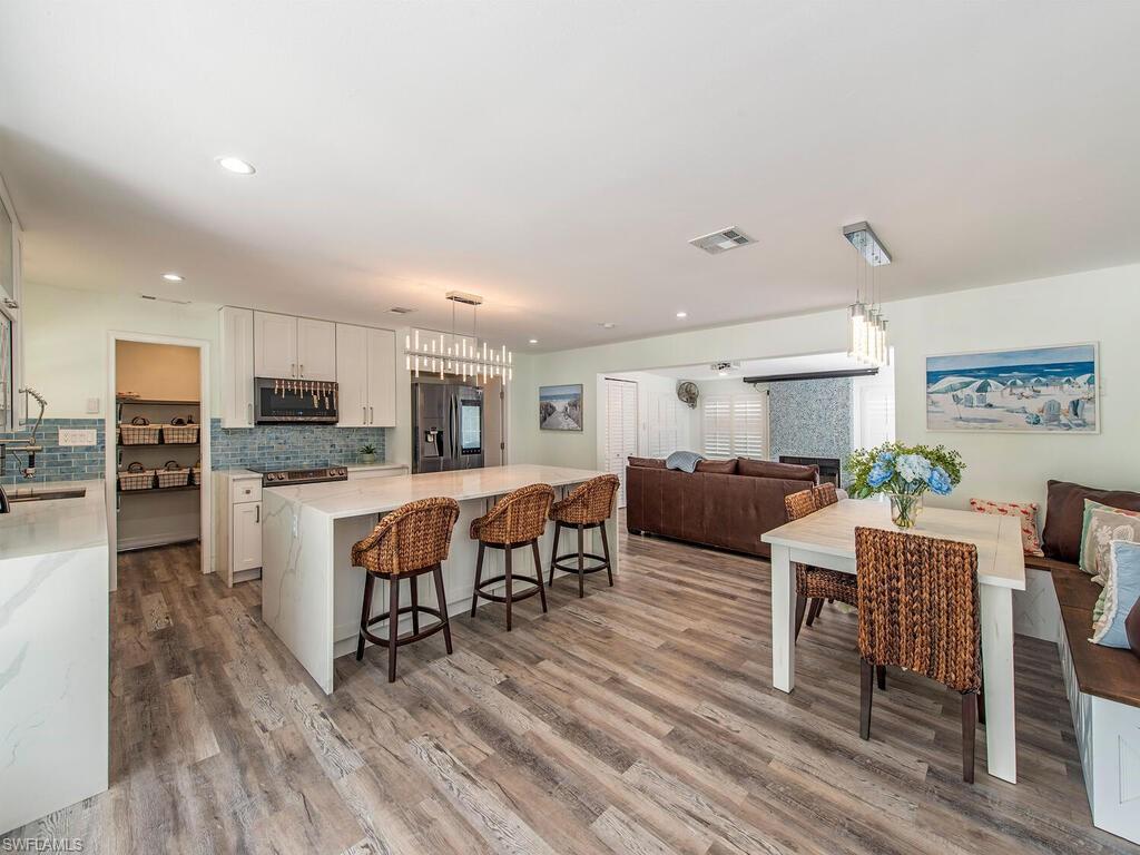 778 5th Avenue North Naples, FL 34102 - Photo 13 of 23 a living room with lots of furniture and kitchen view