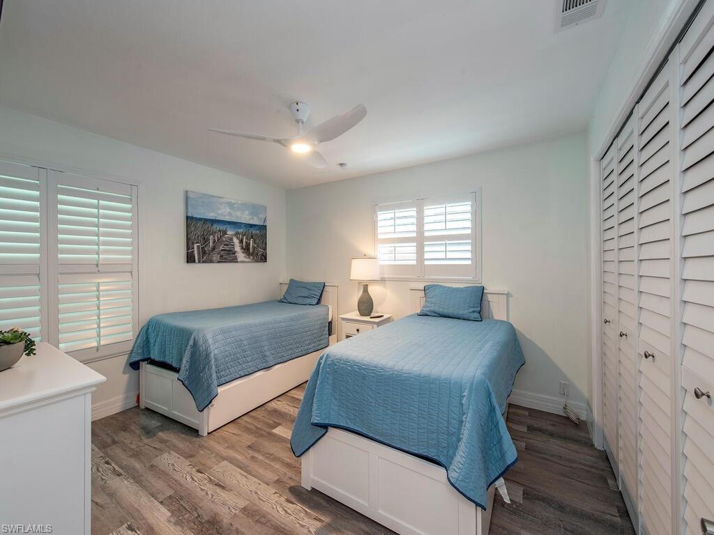 778 5th Avenue North Naples, FL 34102 - Photo 19 of 23 a bedroom with a large bed and a window
