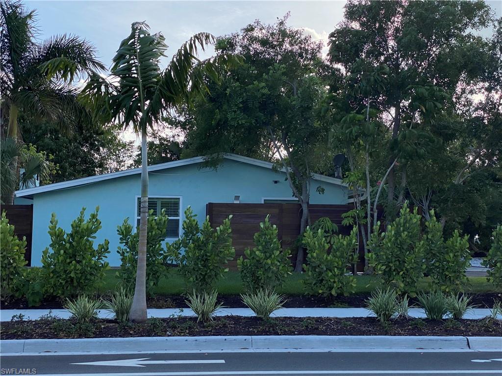 778 5th Avenue North Naples, FL 34102 - Photo 2 of 23 an aerial view of a house with a yard and trees