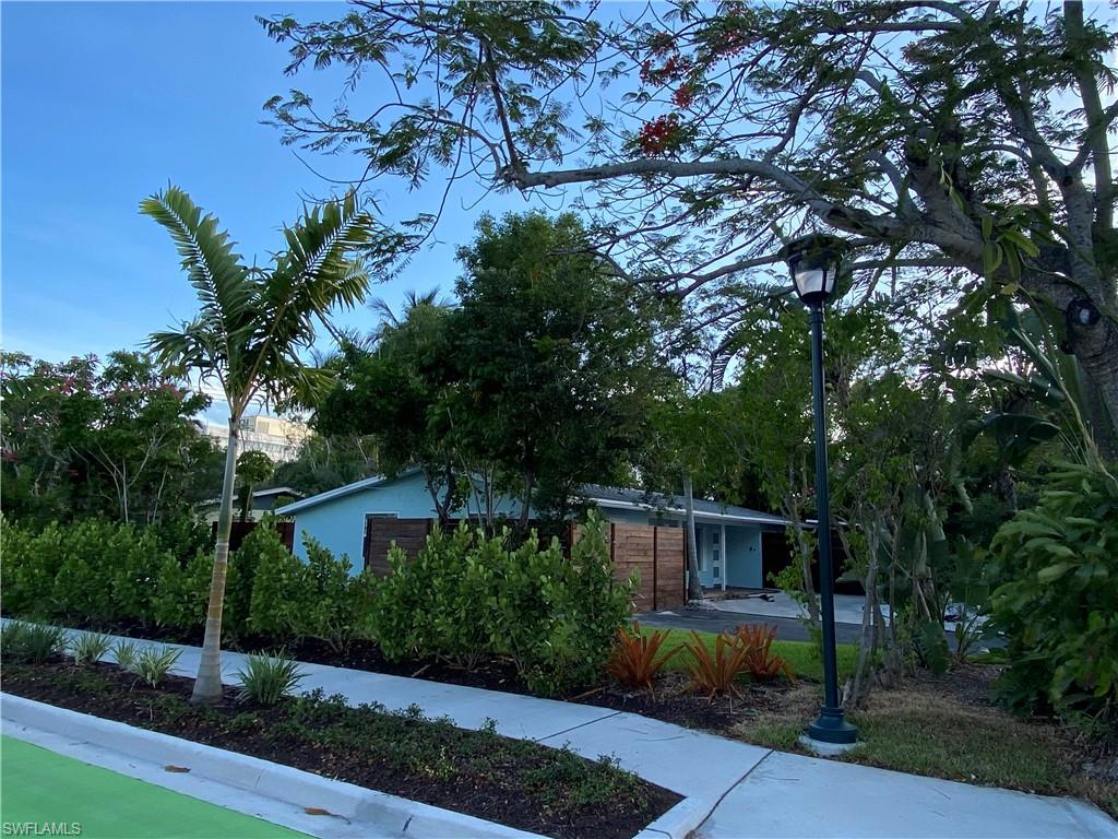 778 5th Avenue North Naples, FL 34102 - Photo 7 of 23 a front view of a house with garden