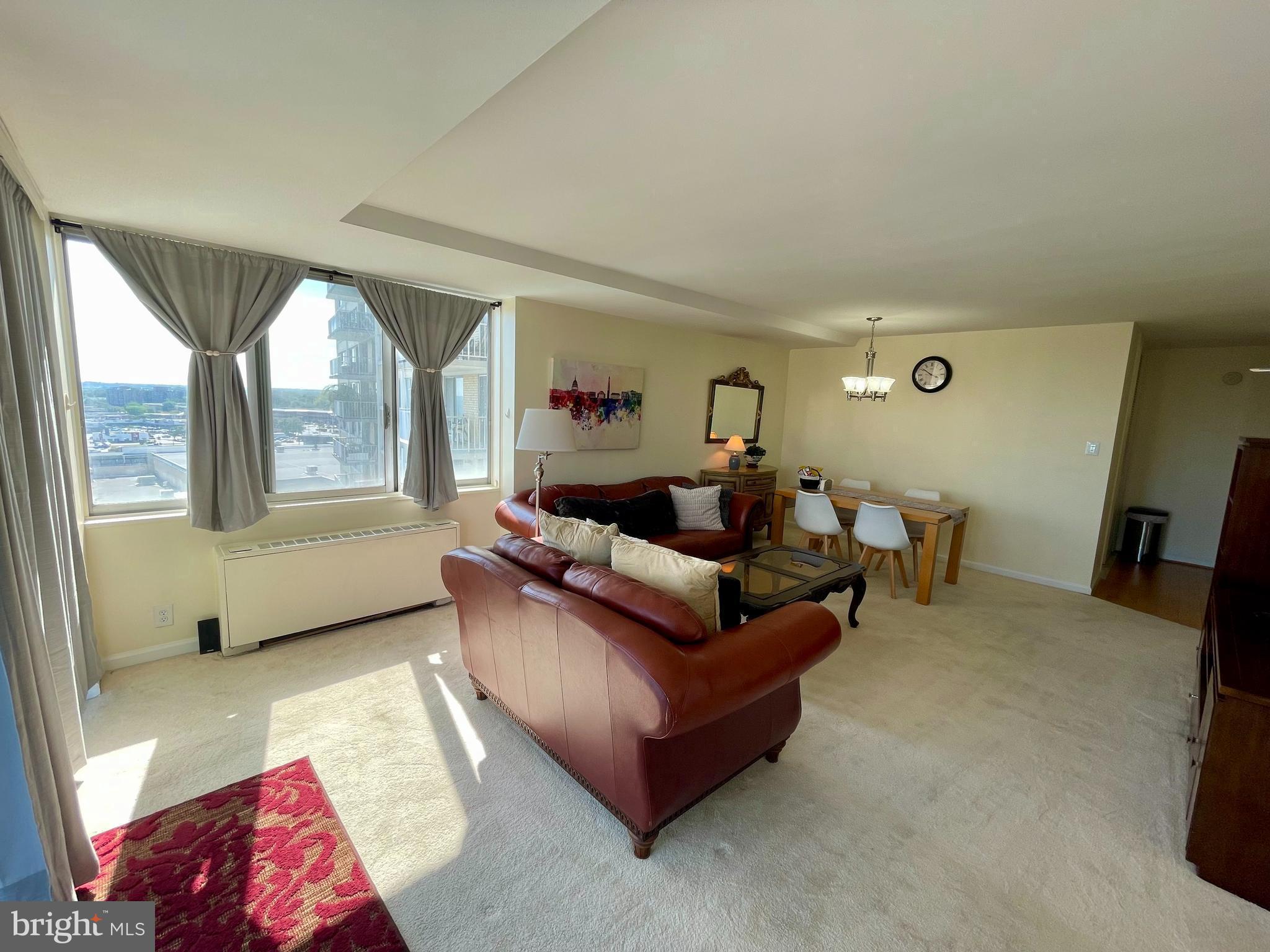 301 North Beauregard Street, Unit 1201 Alexandria, VA 22312 - Photo 3 of 7 a living room with furniture and a large window