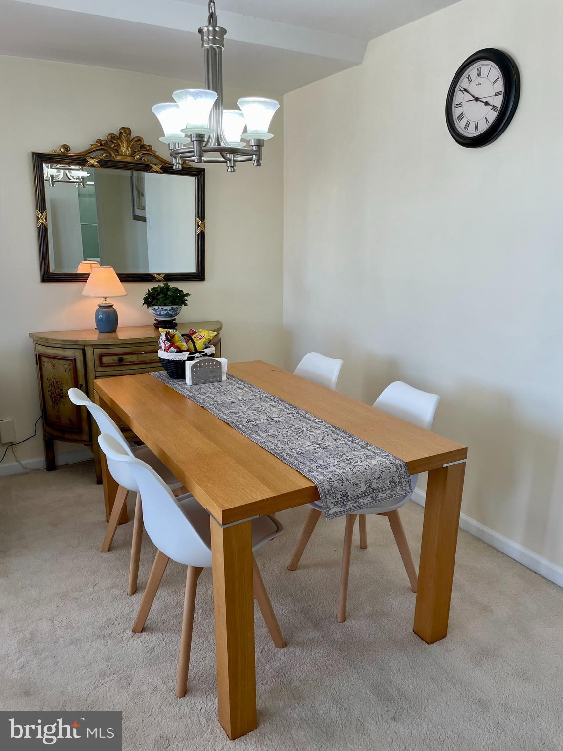 301 North Beauregard Street, Unit 1201 Alexandria, VA 22312 - Photo 4 of 7 a dining room with a table and chairs