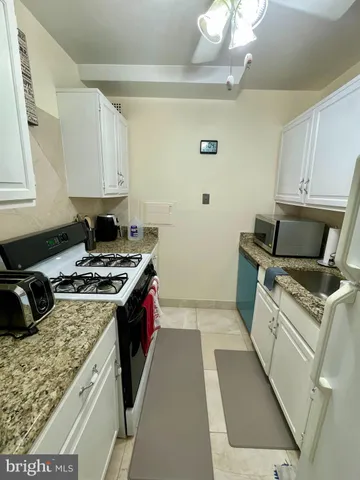 a kitchen with a stove and a sink