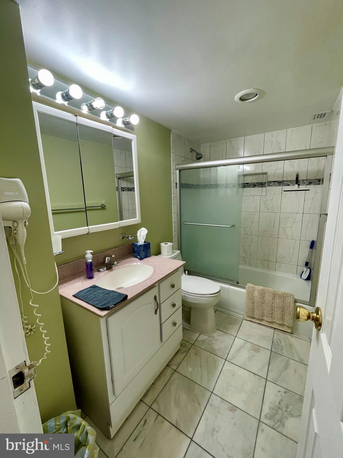 301 North Beauregard Street, Unit 1201 Alexandria, VA 22312 - Photo 7 of 7 a bathroom with a sink toilet and shower