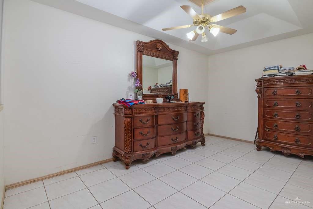 1821 Plainview Street Rio Grande City, TX 78582 - Photo 13 of 21 a room with a dresser and a mirror
