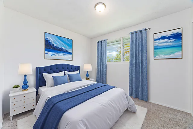 a bedroom with a bed and a painting on the wall