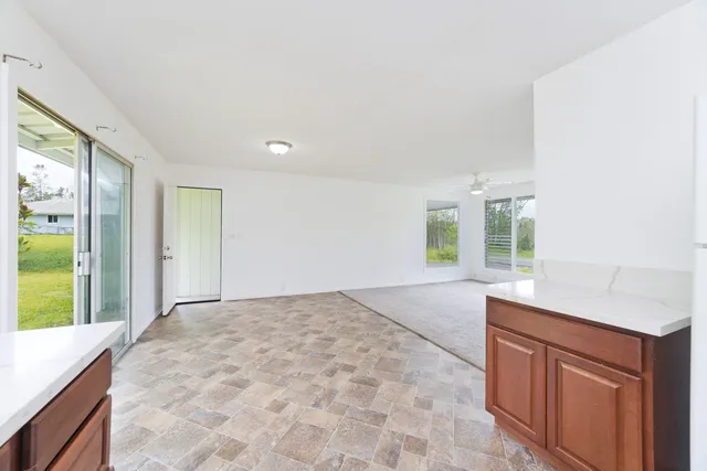 a view of a kitchen with a sink and a window