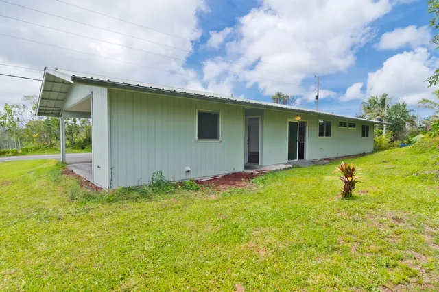 a backyard of a house with lots of green space