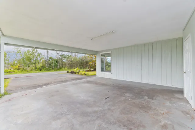a view of livingroom with floor to ceiling window and yard
