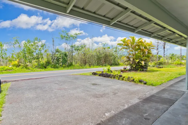 a view of a swimming pool with a yard