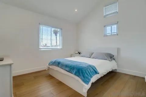 a bedroom with a bed and a table