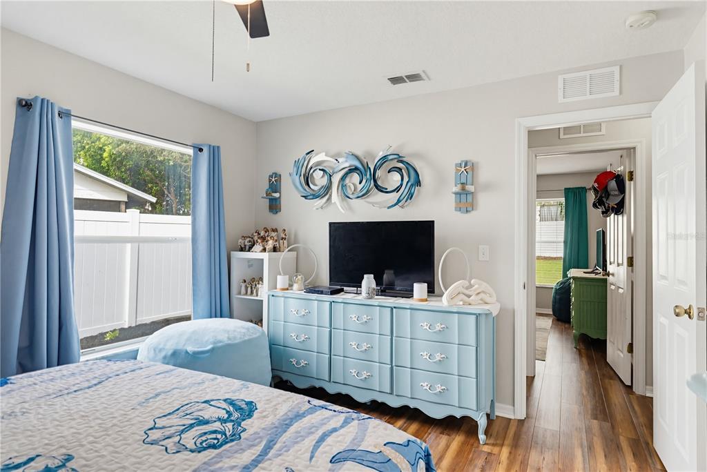 3497 Chadwick Avenue Spring Hill, FL 34609 - Photo 31 of 47 a bedroom with furniture and a fireplace