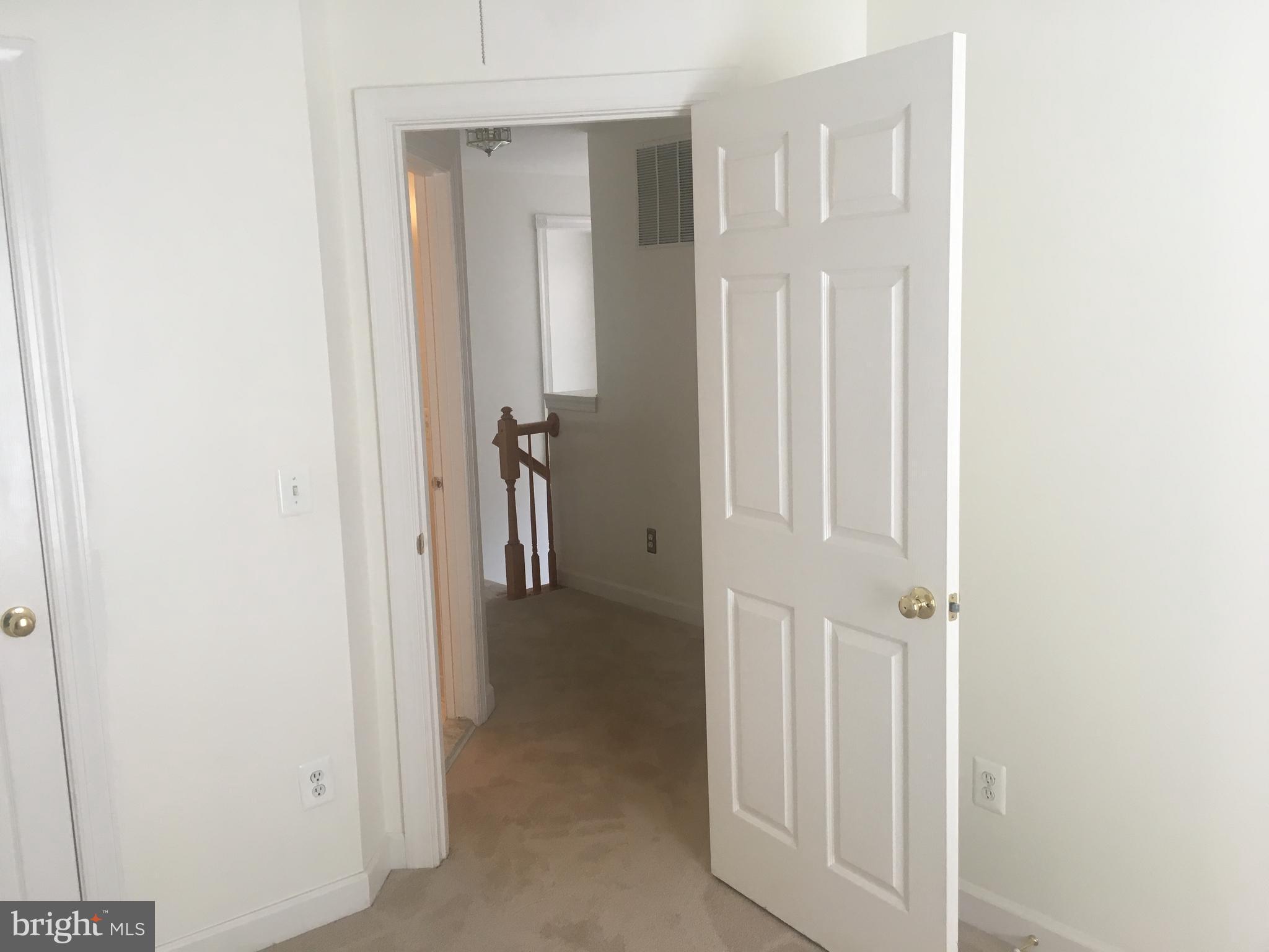 5801 Summers Grove Road Alexandria, VA 22304 - Photo 12 of 27 a view of a hallway with two rooms