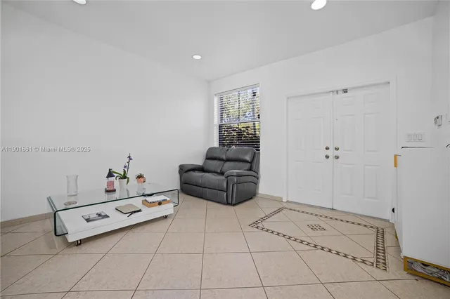 a room with a couch and a baby crib