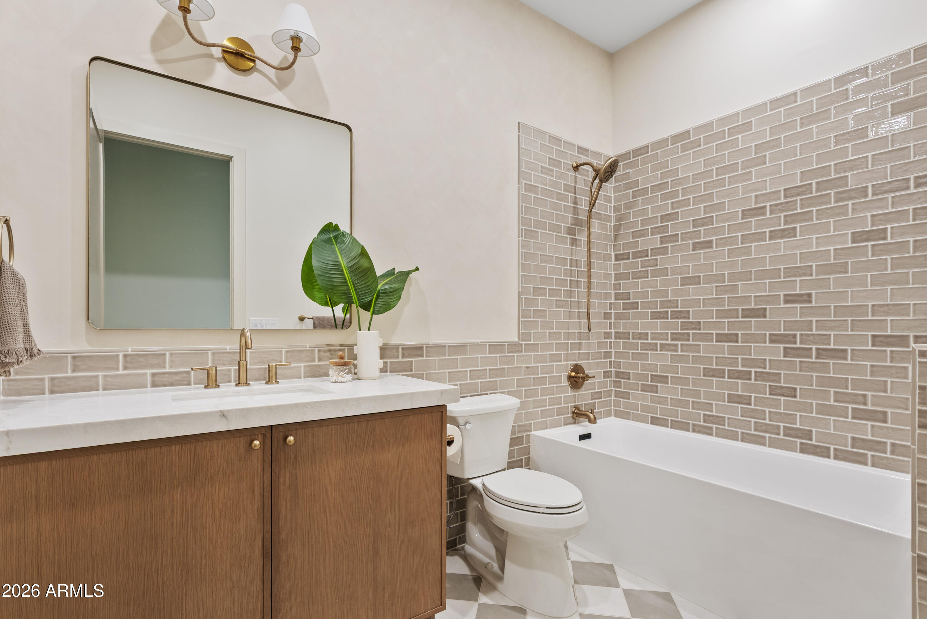 4035 East Osborn Road Phoenix, AZ 85018 - Photo 39 of 63 a bathroom with a granite countertop sink toilet a large mirror and shower