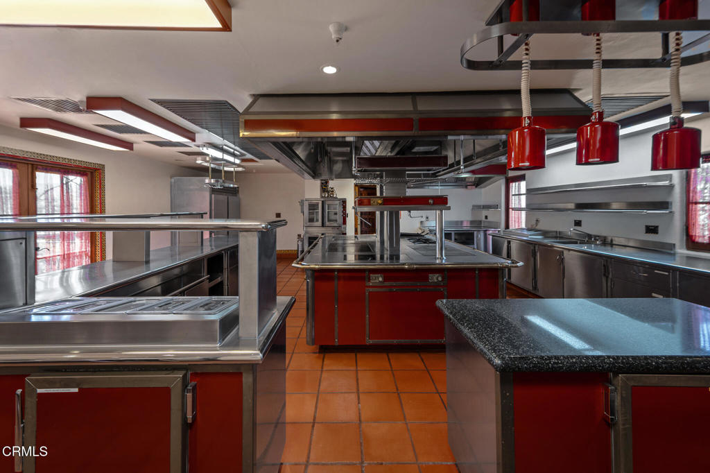 2940 Kuehner Drive Simi Valley, CA 93063 - Photo 45 of 75 a kitchen with stainless steel appliances granite countertop a sink a stove and a microwave