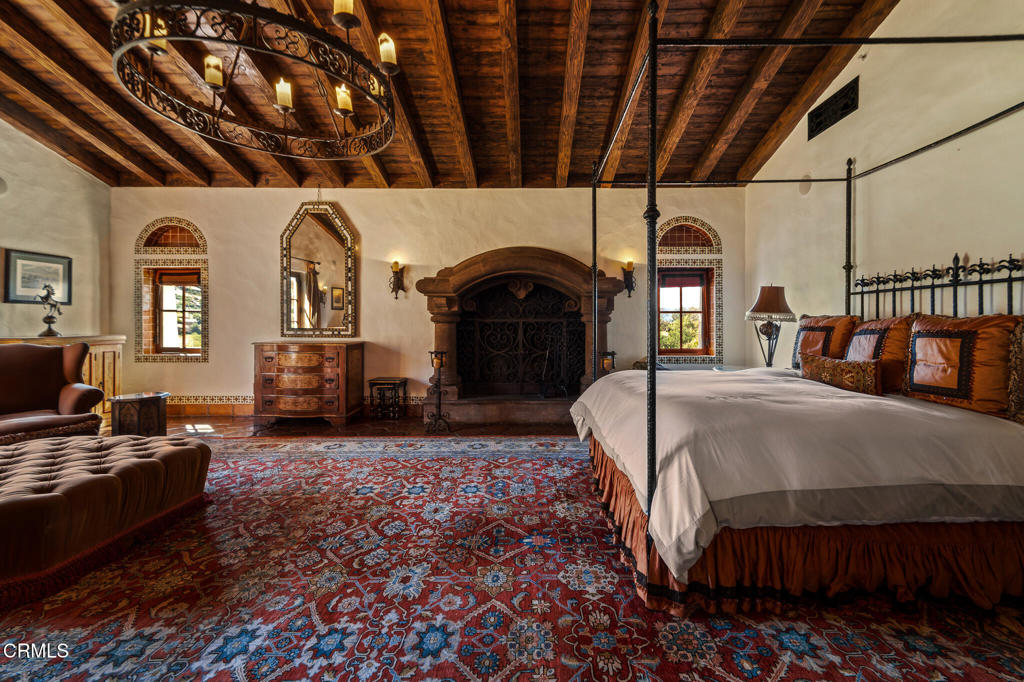 2940 Kuehner Drive Simi Valley, CA 93063 - Photo 56 of 75 a bed room with a bed and a fireplace