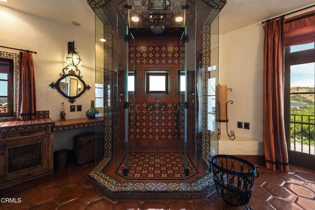 2940 Kuehner Drive Simi Valley, CA 93063 - Photo 58 of 75 a bathroom with a sink a mirror and a shower