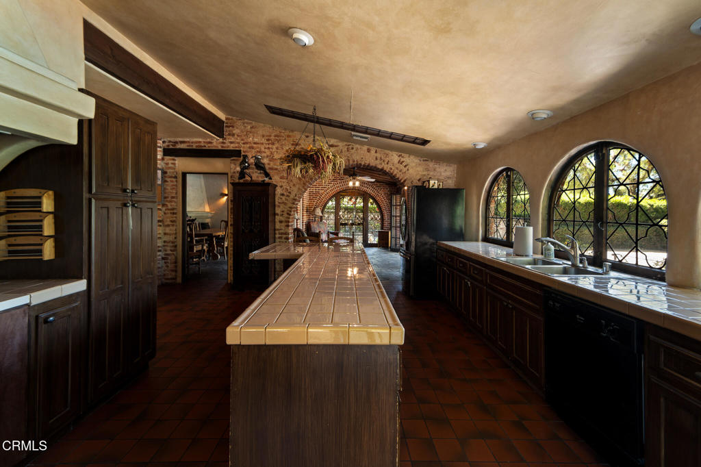 2940 Kuehner Drive Simi Valley, CA 93063 - Photo 68 of 75 a living room with stainless steel appliances kitchen island granite countertop furniture a large window and a fireplace