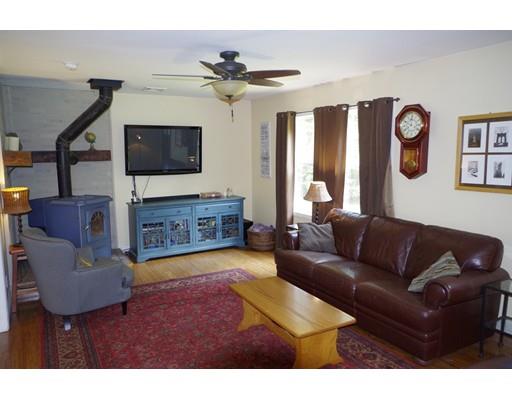 196 Reservoir Road Westhampton, MA 01027 - Photo 17 of 36 a living room with furniture and a flat screen tv