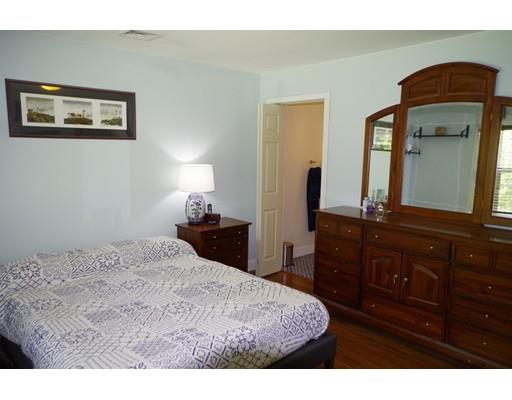 196 Reservoir Road Westhampton, MA 01027 - Photo 23 of 36 a bedroom with a bed and a mirror on dresser