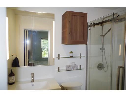 196 Reservoir Road Westhampton, MA 01027 - Photo 25 of 36 a bathroom with a tub sink and mirror