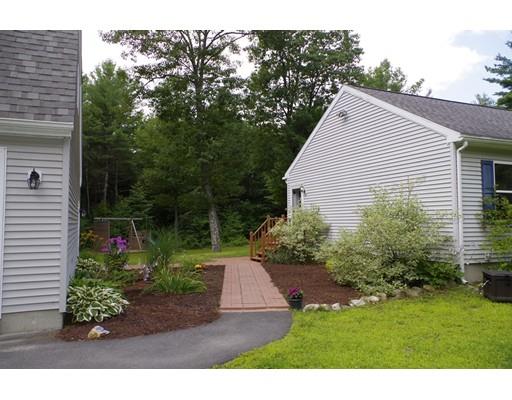 196 Reservoir Road Westhampton, MA 01027 - Photo 3 of 36 a backyard of a house with plants and large trees