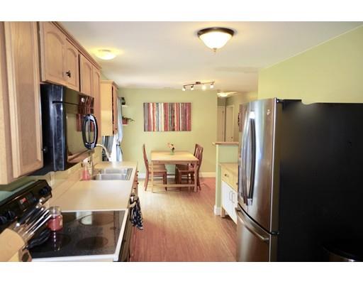 196 Reservoir Road Westhampton, MA 01027 - Photo 8 of 36 a living room with stainless steel appliances furniture a refrigerator and a kitchen view