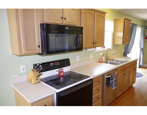 196 Reservoir Road Westhampton, MA 01027 - Photo 9 of 36 a kitchen with a sink cabinets and a wooden floor