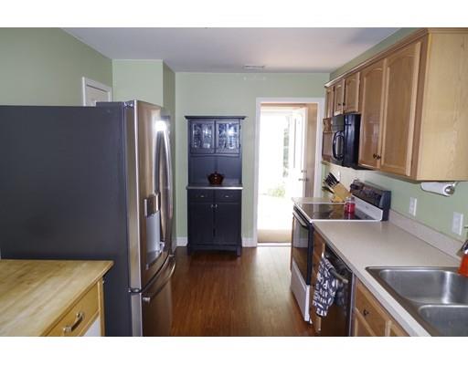 196 Reservoir Road Westhampton, MA 01027 - Photo 10 of 36 a kitchen with stainless steel appliances granite countertop a refrigerator and a sink