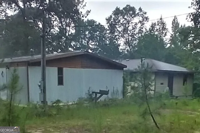 a backyard of a house with lots of green space