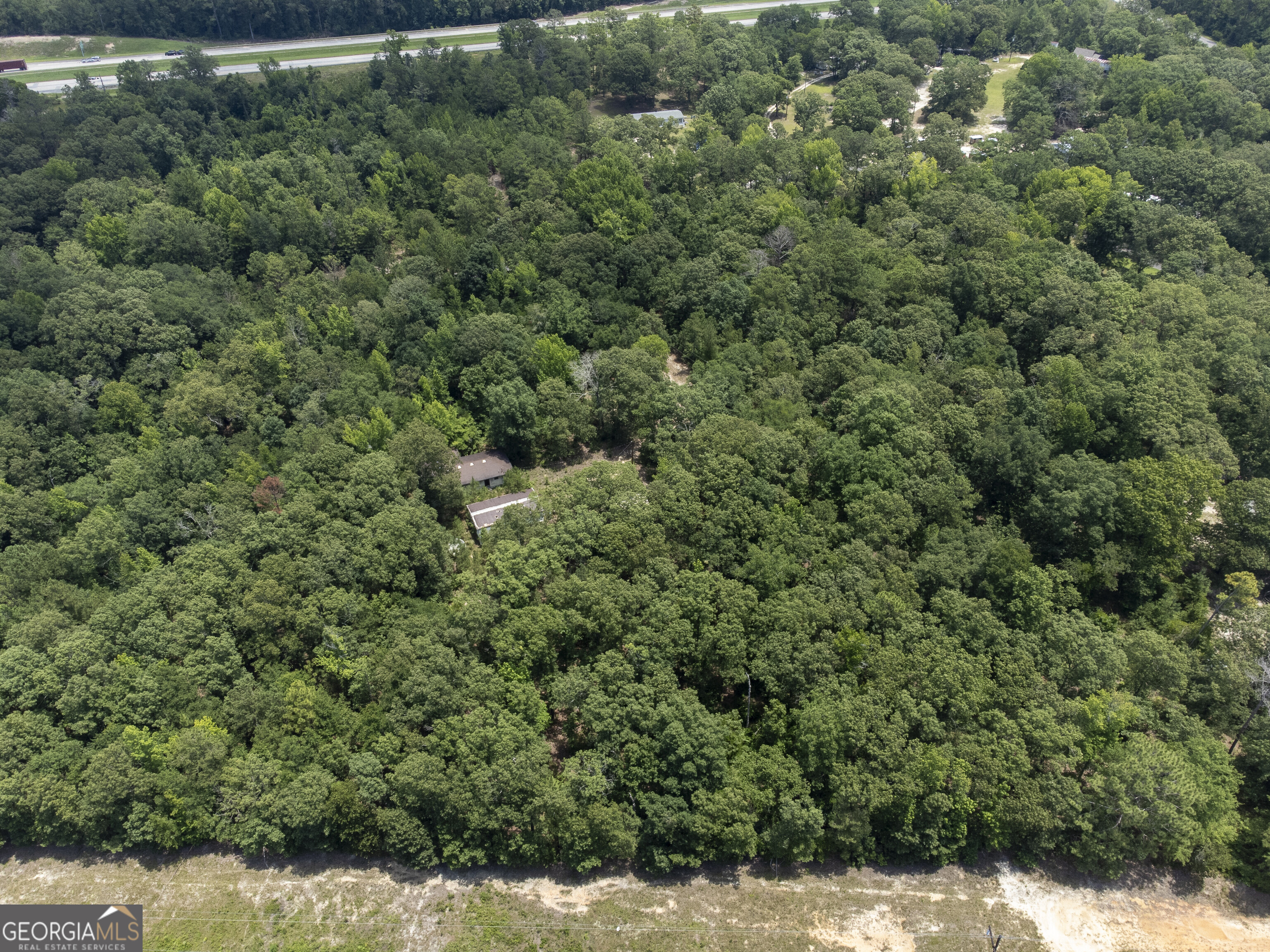 456 Horseshoe Circle Macon, GA 31217 - Photo 27 of 34 an aerial view of residential house with outdoor space and trees all around