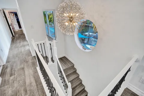 a view of a balcony with wooden floor