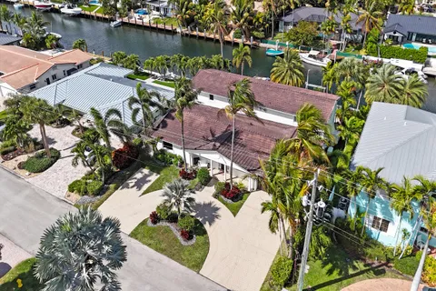 an aerial view of a house with a lake view