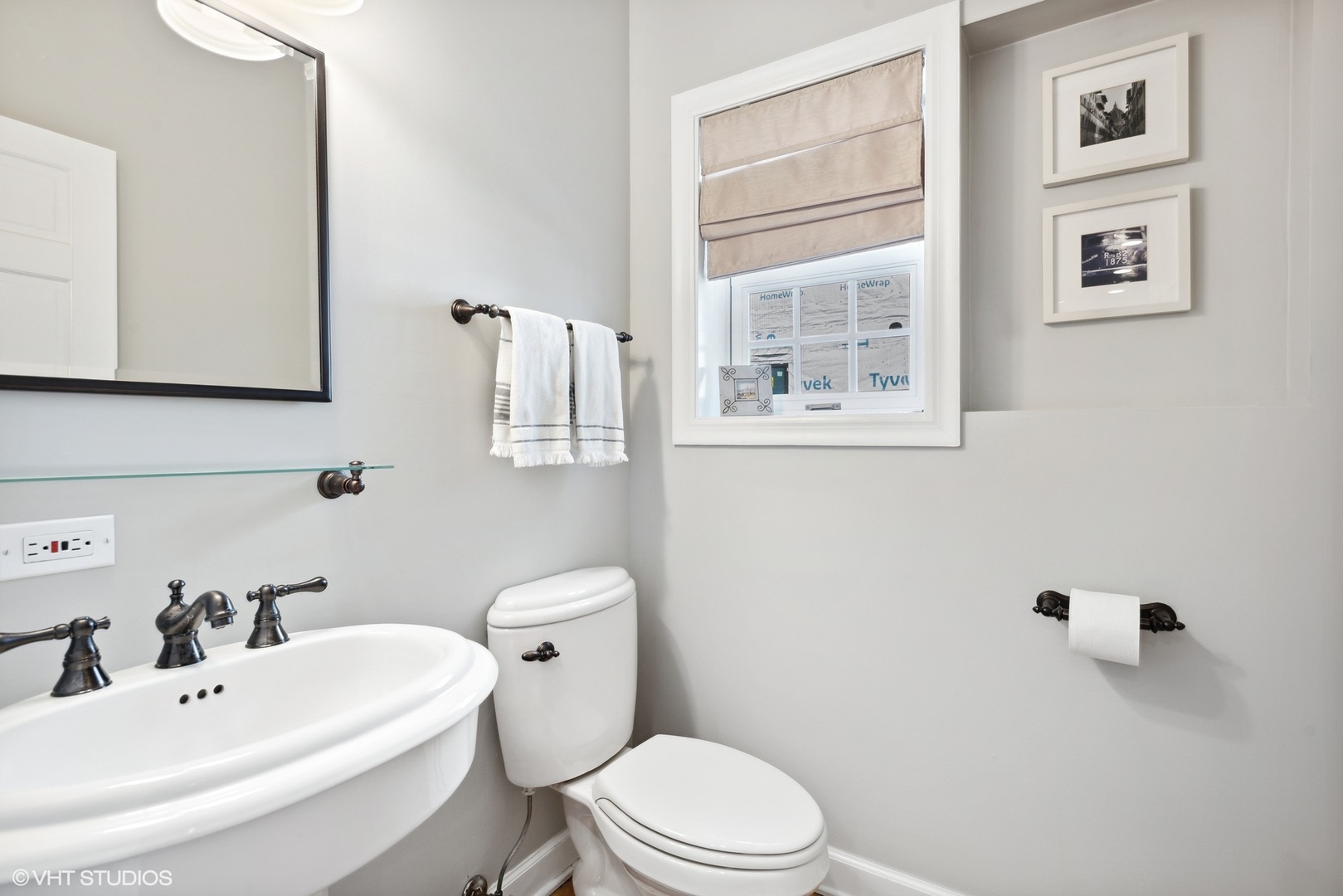 2320 Illinois Road Northbrook, IL 60062 - Photo 15 of 36 a white toilet sitting next to a bathroom sink
